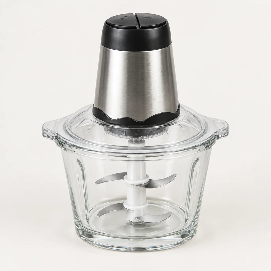 Hachoir électrique 300W à bol en verre de 2 L, bloc moteur inox et noir, 4 lames inox visibles, sur fond blanc cassé