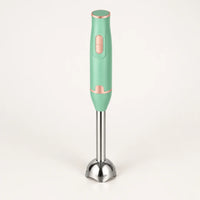 Mixeur plongeant 300 W vert menthe à détails cuivre rosé, pied inox en cloche, debout sur fond clair