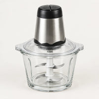 Hachoir électrique 300W à bol en verre de 2 L, bloc moteur inox et noir, 4 lames inox visibles, sur fond blanc cassé