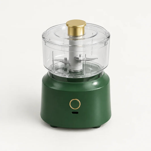 Hachoir électrique sans fil 350 ml à socle vert sapin, bol et couvercle transparents, poussoir doré, sur fond blanc cassé