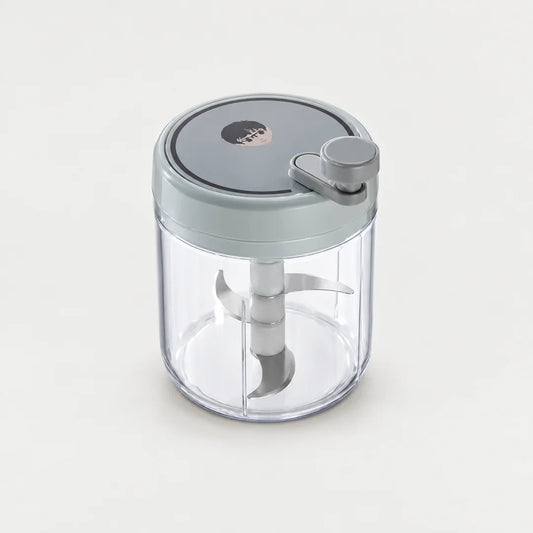 Hachoir manuel rotatif 400 ml à couvercle gris bleuté, petite manivelle grise et bol transparent, sur fond clair