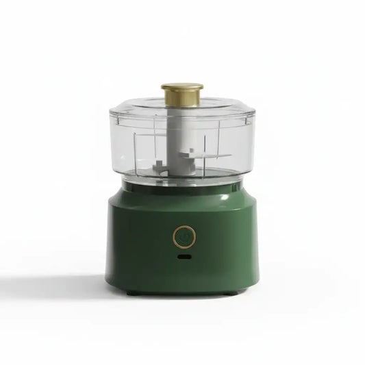 Mini hachoir électrique compact vert forêt avec bol transparent et bouton poussoir doré, sur fond blanc