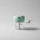 Mini hachoir électrique vert 30W 100ml + 250 ml plastique en situation d'utilisation