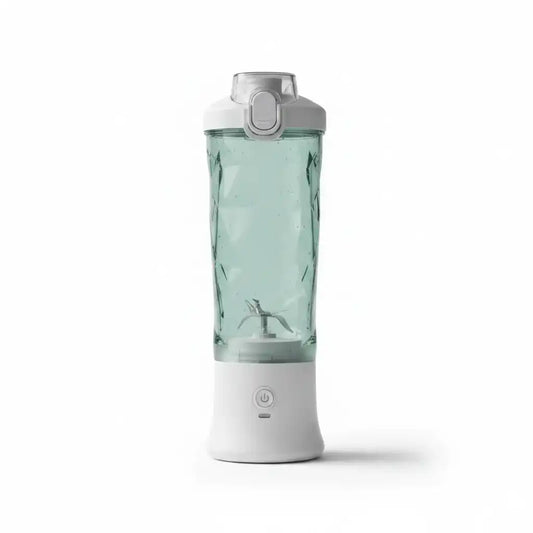 Mixeur portable rechargeable avec cuve transparente à facettes diamant et base blanche, sur fond blanc