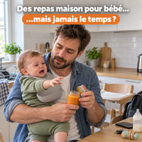 Papa tenant son bébé affamé dans la cuisine avant la préparation d’un repas maison